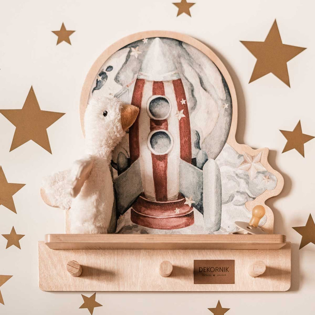 a soft-lit rocketship wall shelf with a friendly dinosaur, offering cozy organization for a child's room