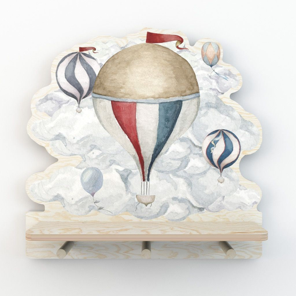 elegant white plywood mini wall shelf with a whimsical dinosaur sticker and three wooden pegs