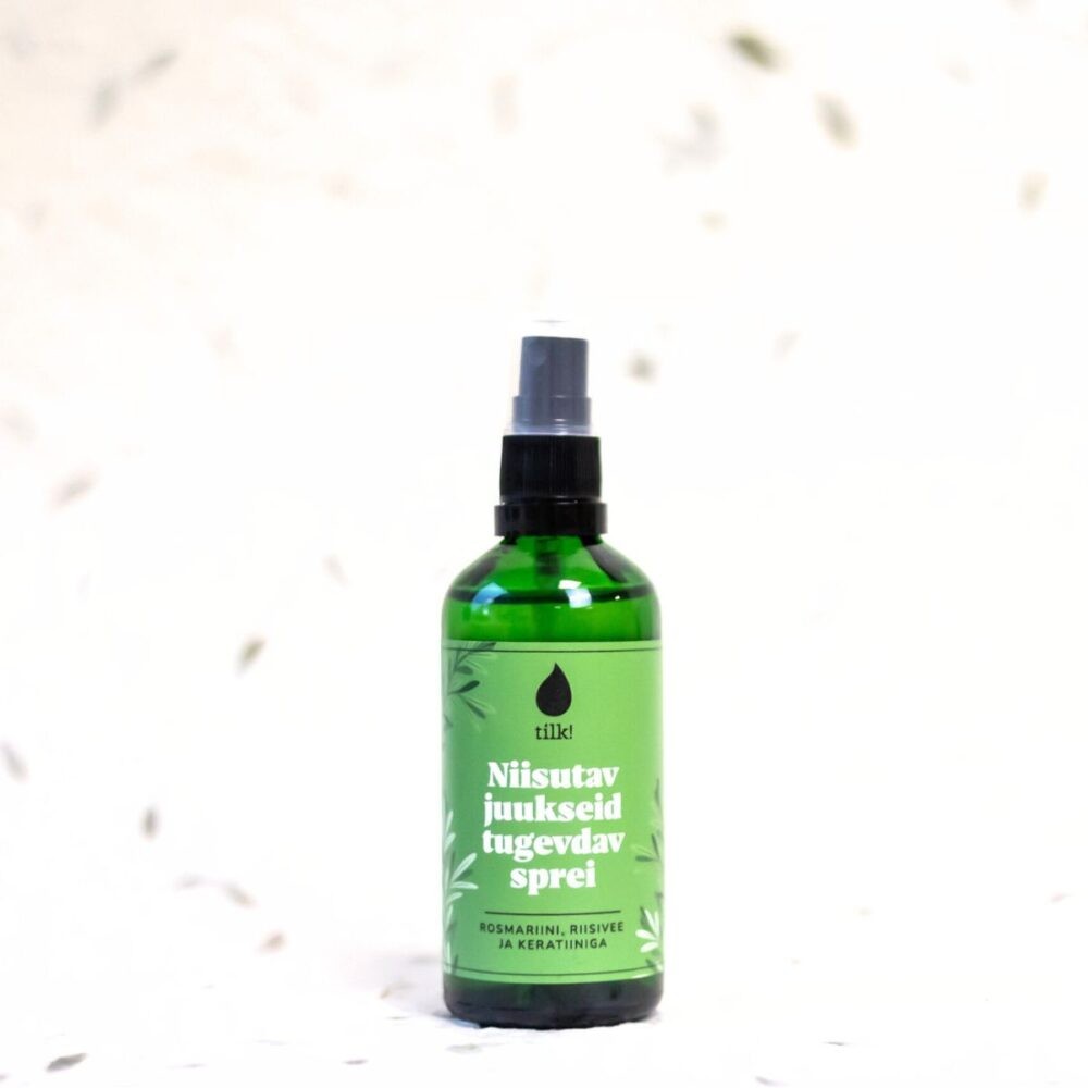 soft mist of moisturizing hair spray with rosemary hydrosol, glowing in warm light for silky, protected strands