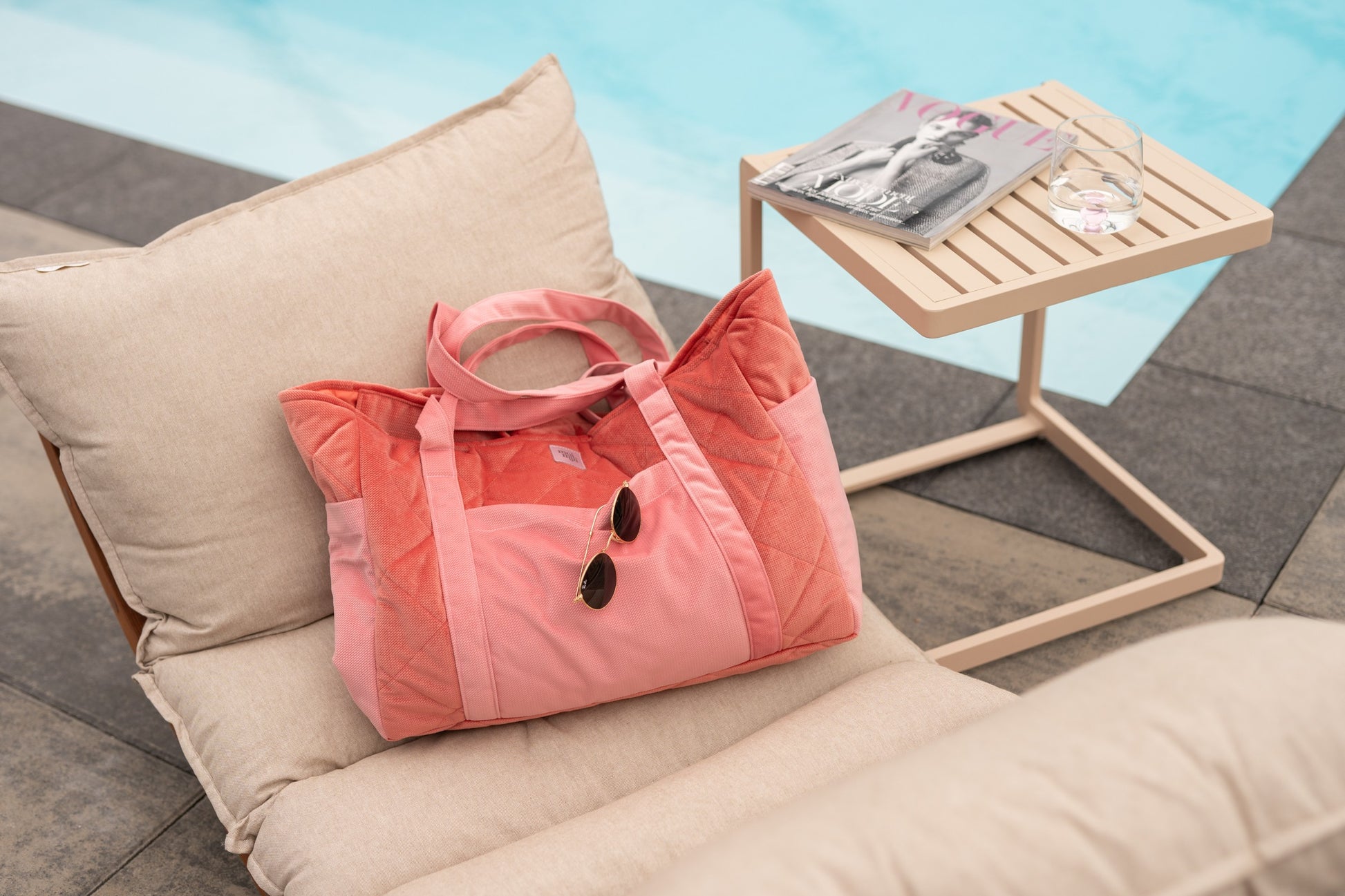 candy-pink velvet weekender bag with dual straps, open to show organized pockets and waterproof lining