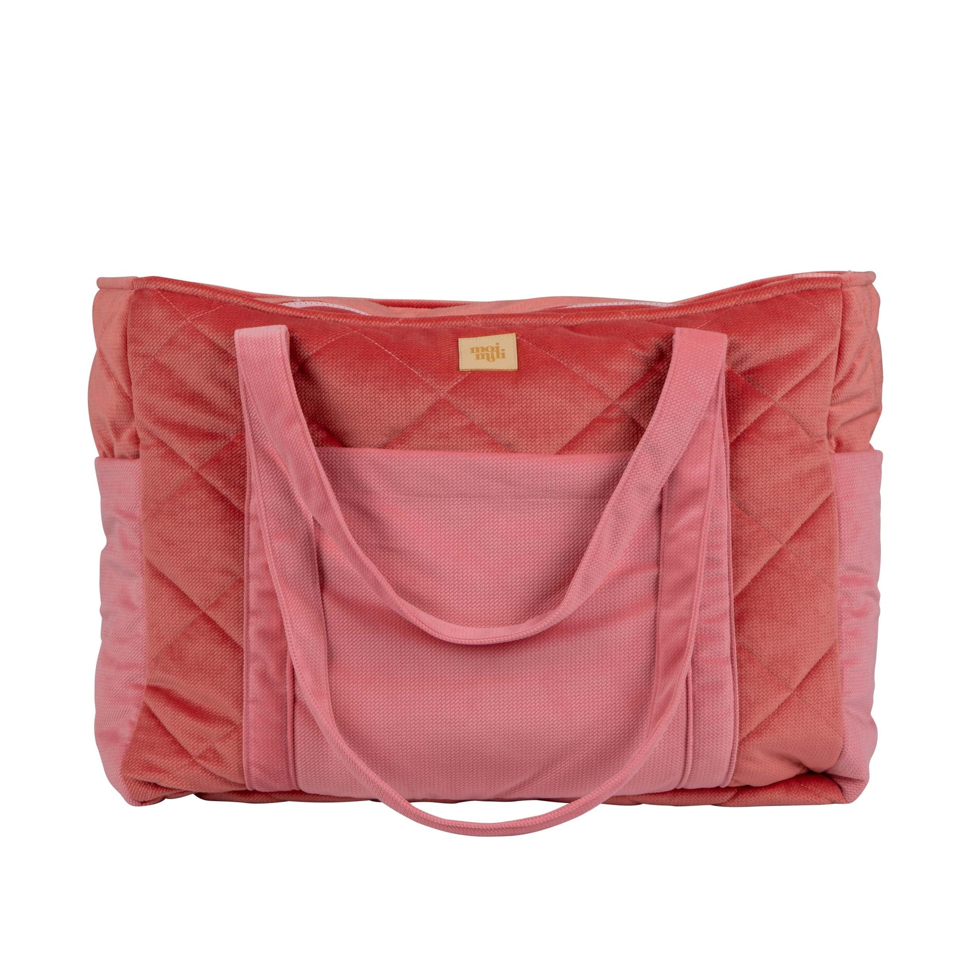 candy-pink velvet weekender bag with dual straps, open to show organized pockets and waterproof lining