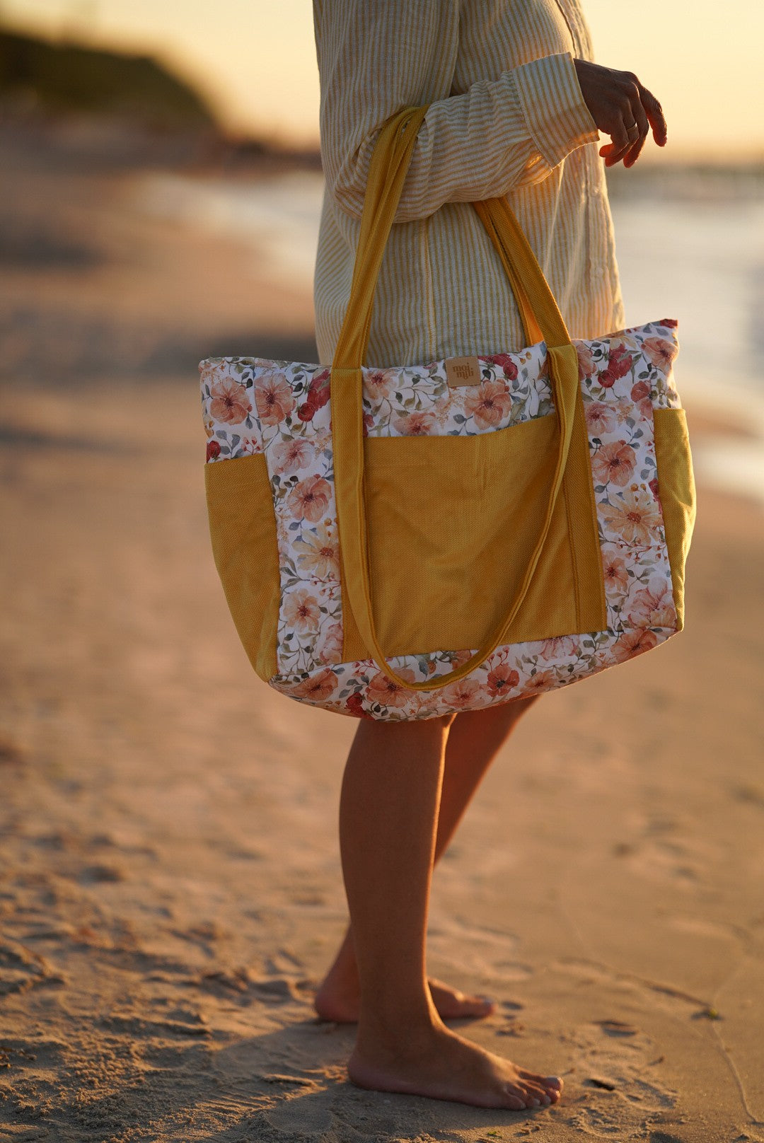elegant velvet weekender bag with floral print, showcasing refined details and organized pockets