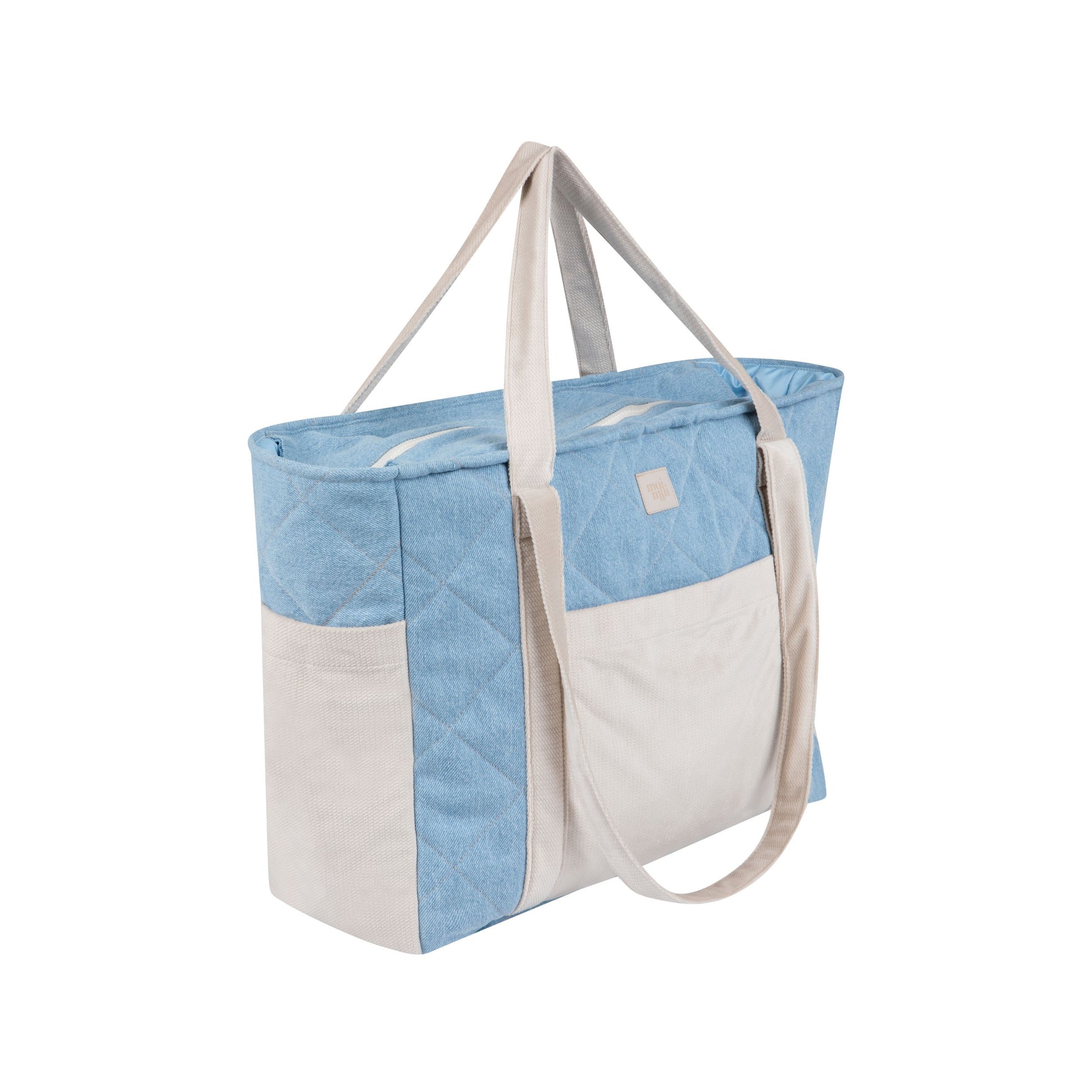 soft blue jeans weekender bag with velvet trim, open to show spacious interior and multiple pockets