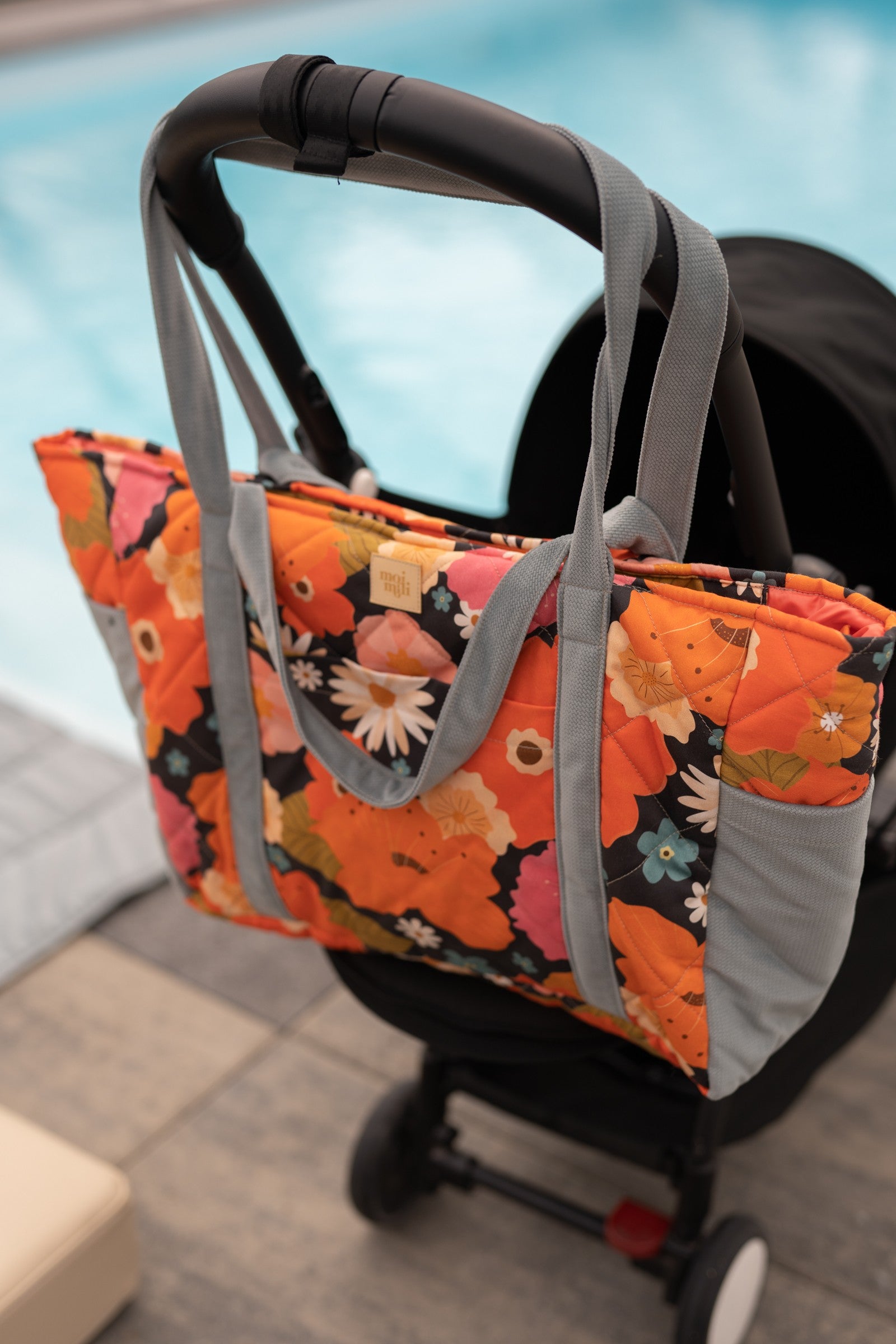 bold floral weekender bag with velvet texture and multiple pockets, perfect for moms on the go