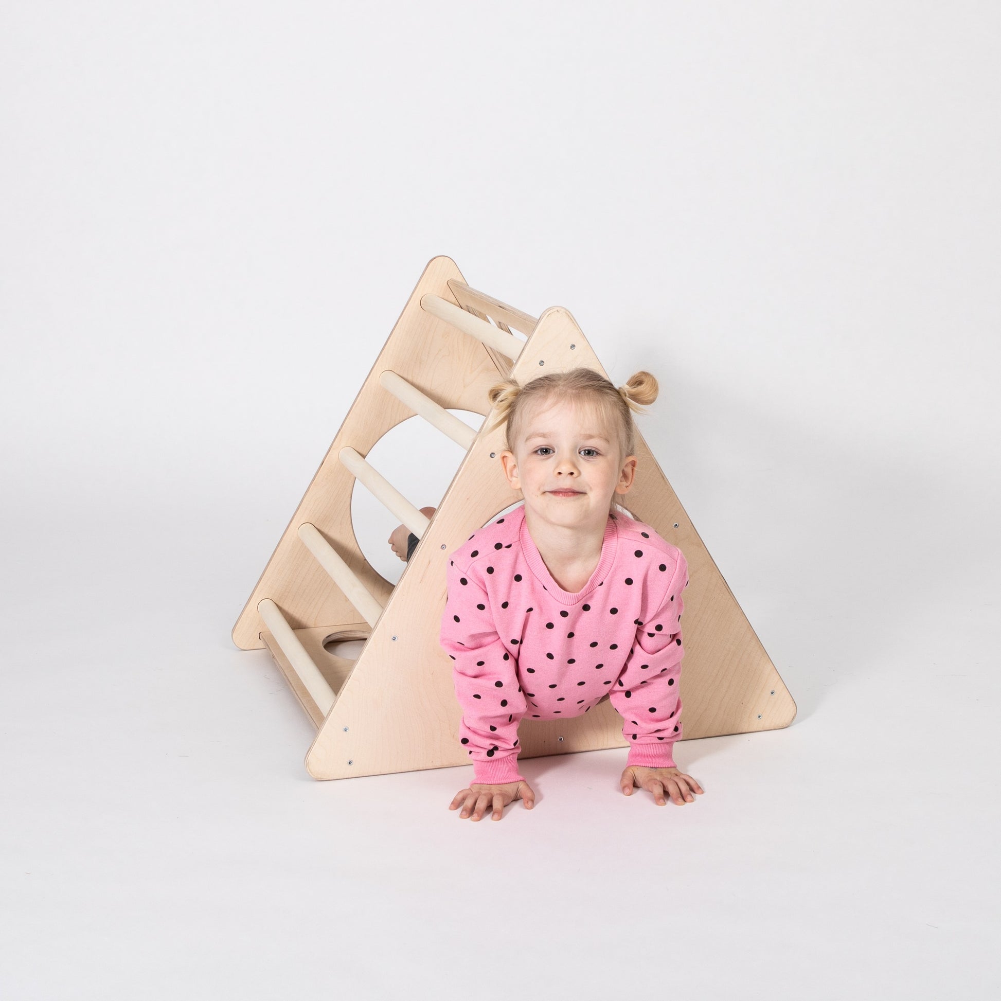 elegant montessori 3-angle climber in natural birch plywood, showcasing smooth curves and minimalist design for refined play spaces