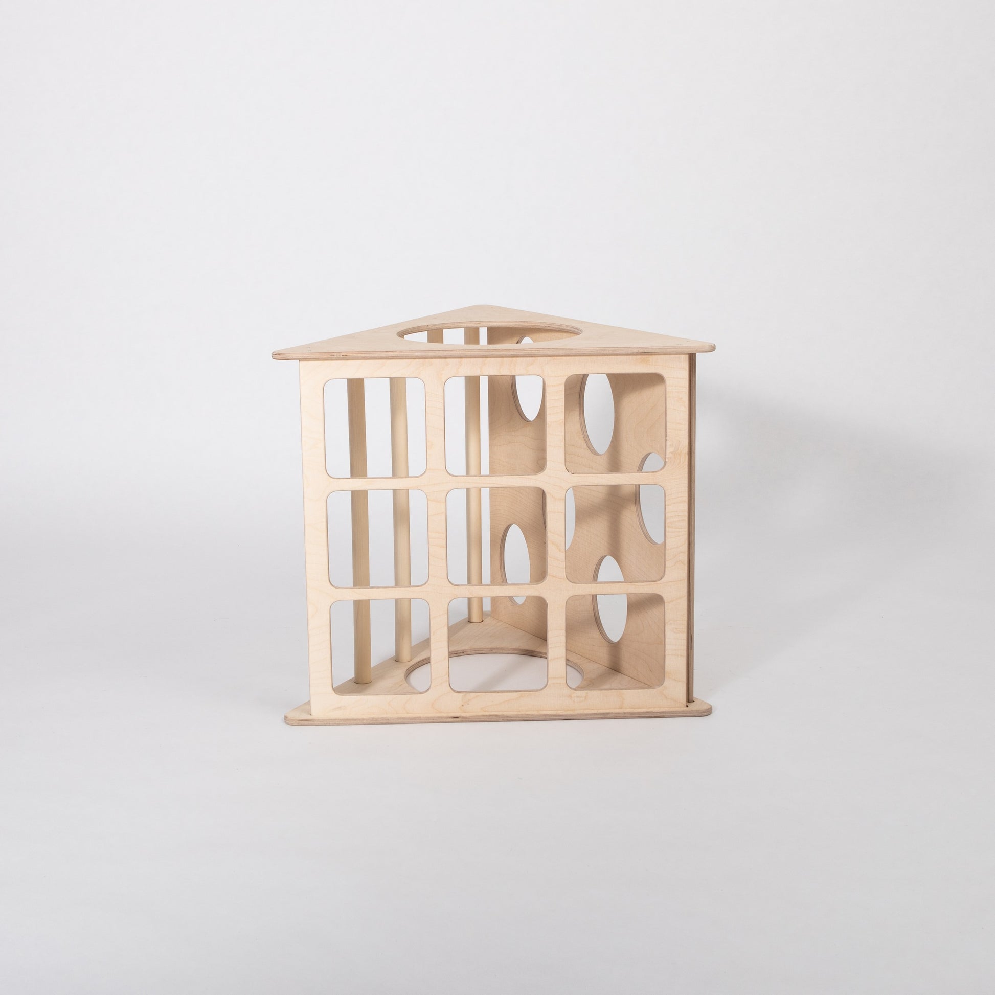 montessori 3-angle climber in a cozy playroom with soft morning light highlighting its smooth birch plywood rungs