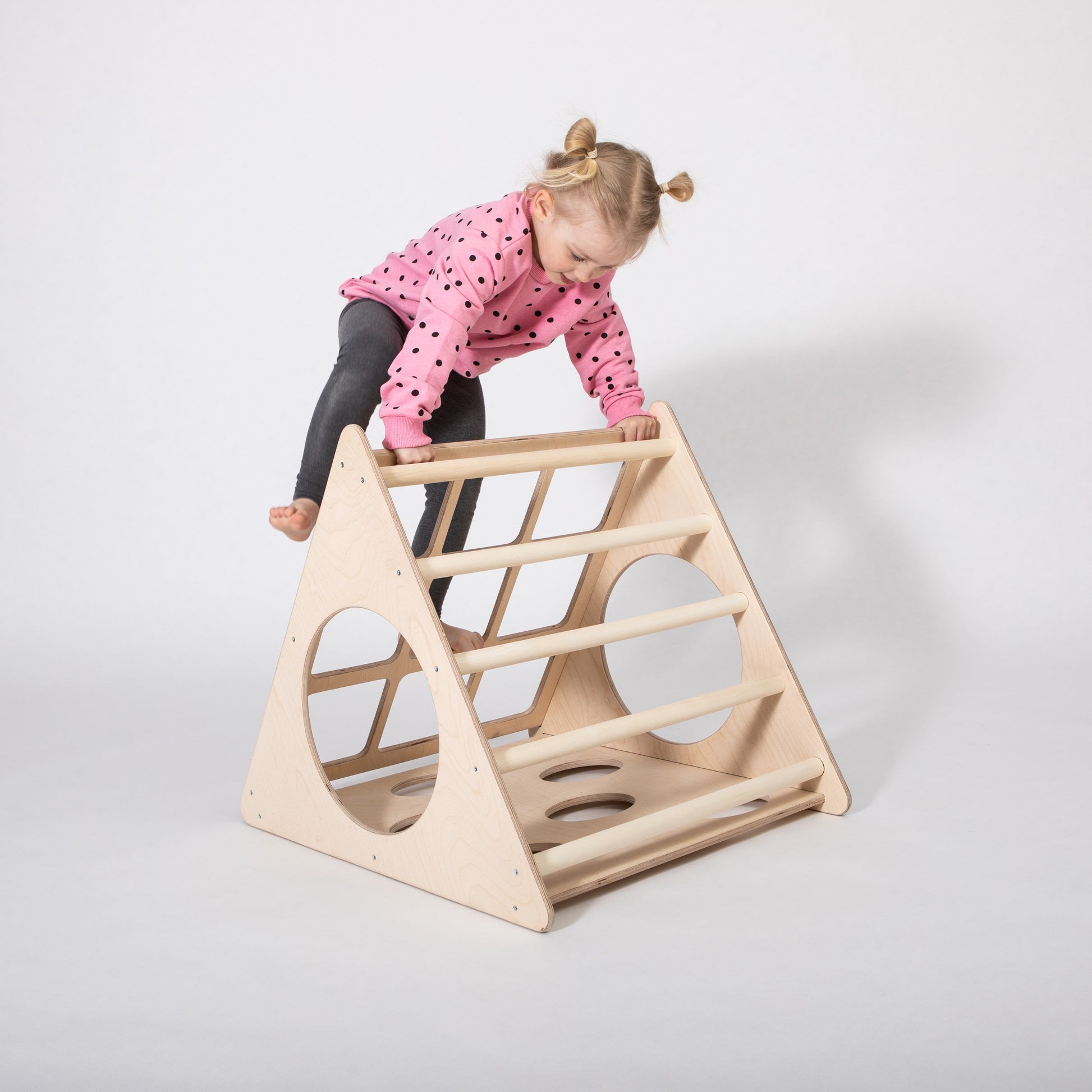 montessori 3-angle climber in a bright playroom, showcasing sturdy birch plywood construction and safe climbing rungs for toddlers