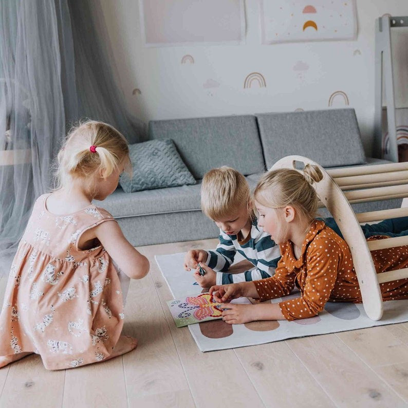 montessori climbing arch with ramp in use as a balance board, showcasing sturdy baltic birch plywood construction