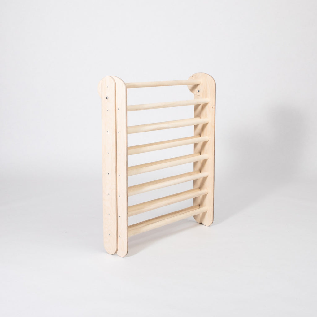 foldable montessori climbing triangle with eight rings, bathed in warm natural light, perfect for toddler adventures