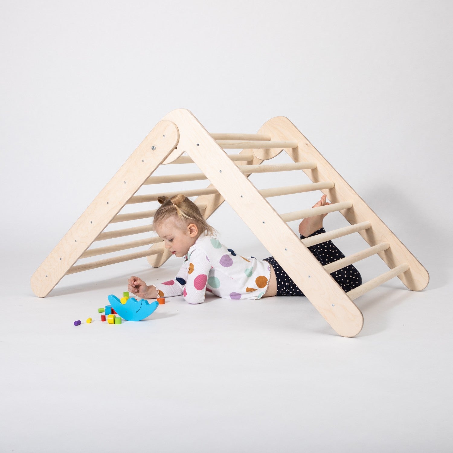 bold montessori climbing triangle with eight rings, foldable for small spaces, toddler climbing confidently