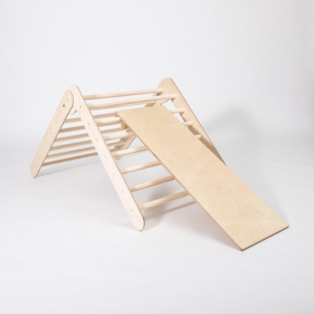 foldable montessori climbing triangle with ramp in natural birch, showcasing sturdy rings and smooth slide surface for toddlers