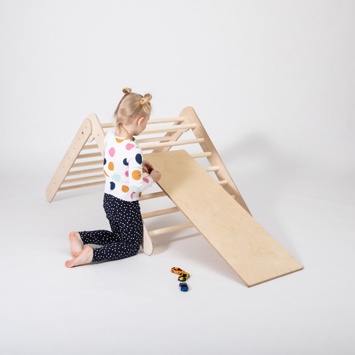 bold montessori climbing triangle with ramp for toddlers - sturdy birch plywood foldable gym in action