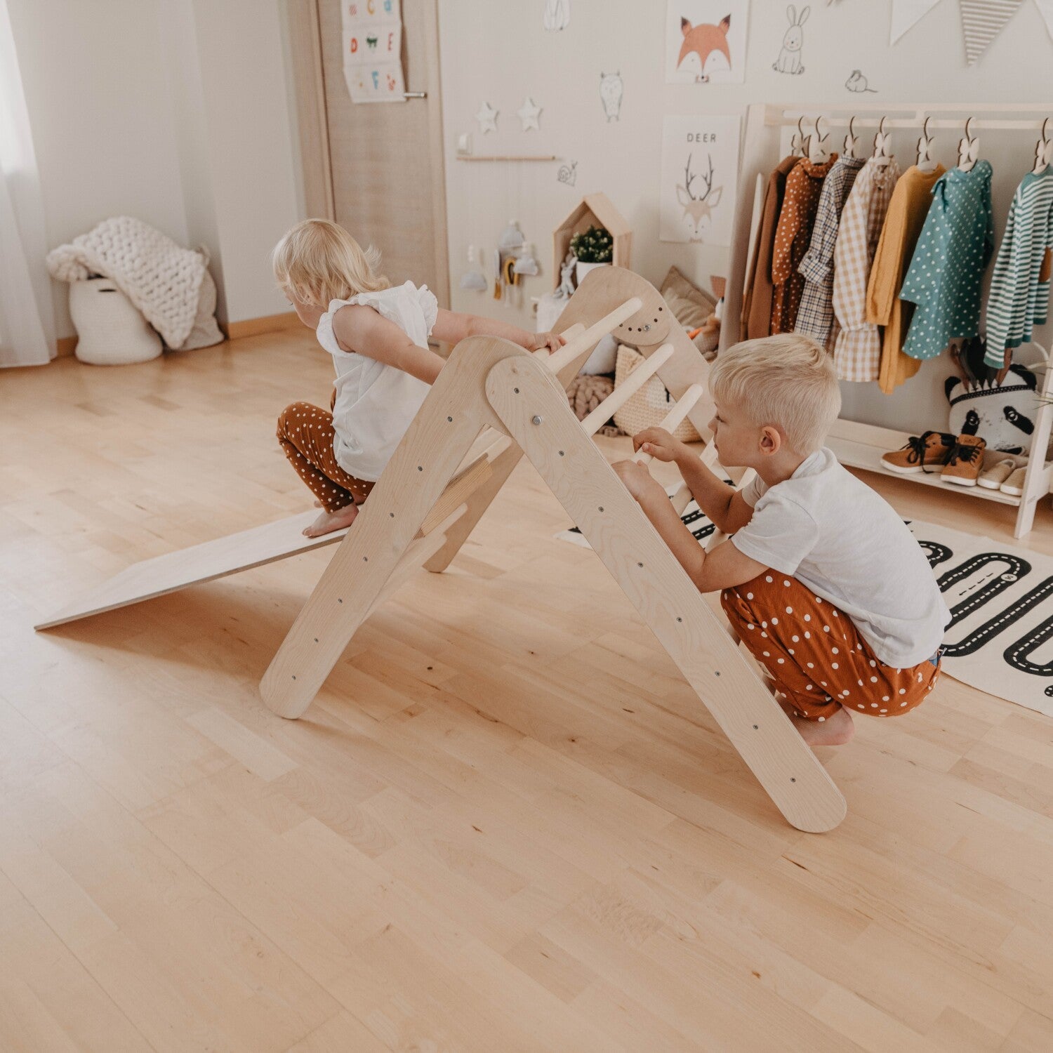 elegant montessori climbing triangle with ramp in natural birch, showcasing refined design and sturdy construction for toddlers
