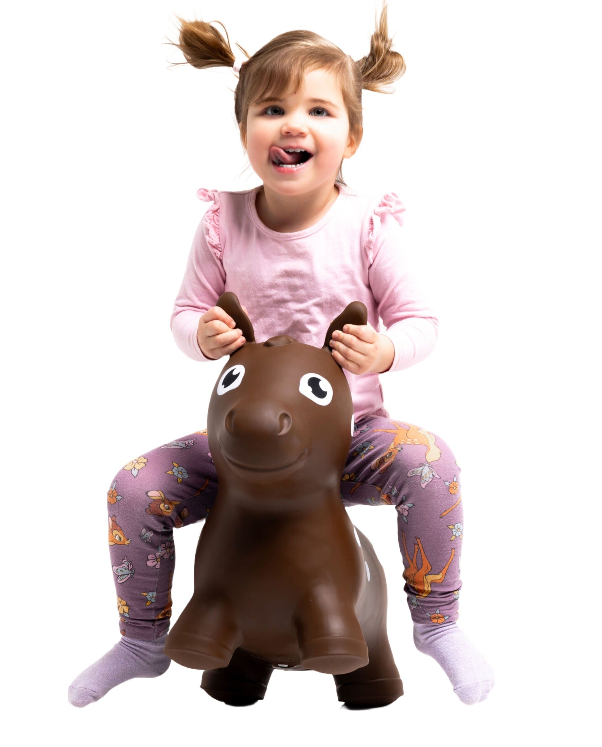 confident toddler bouncing on a sturdy brown horse hopper toy indoors