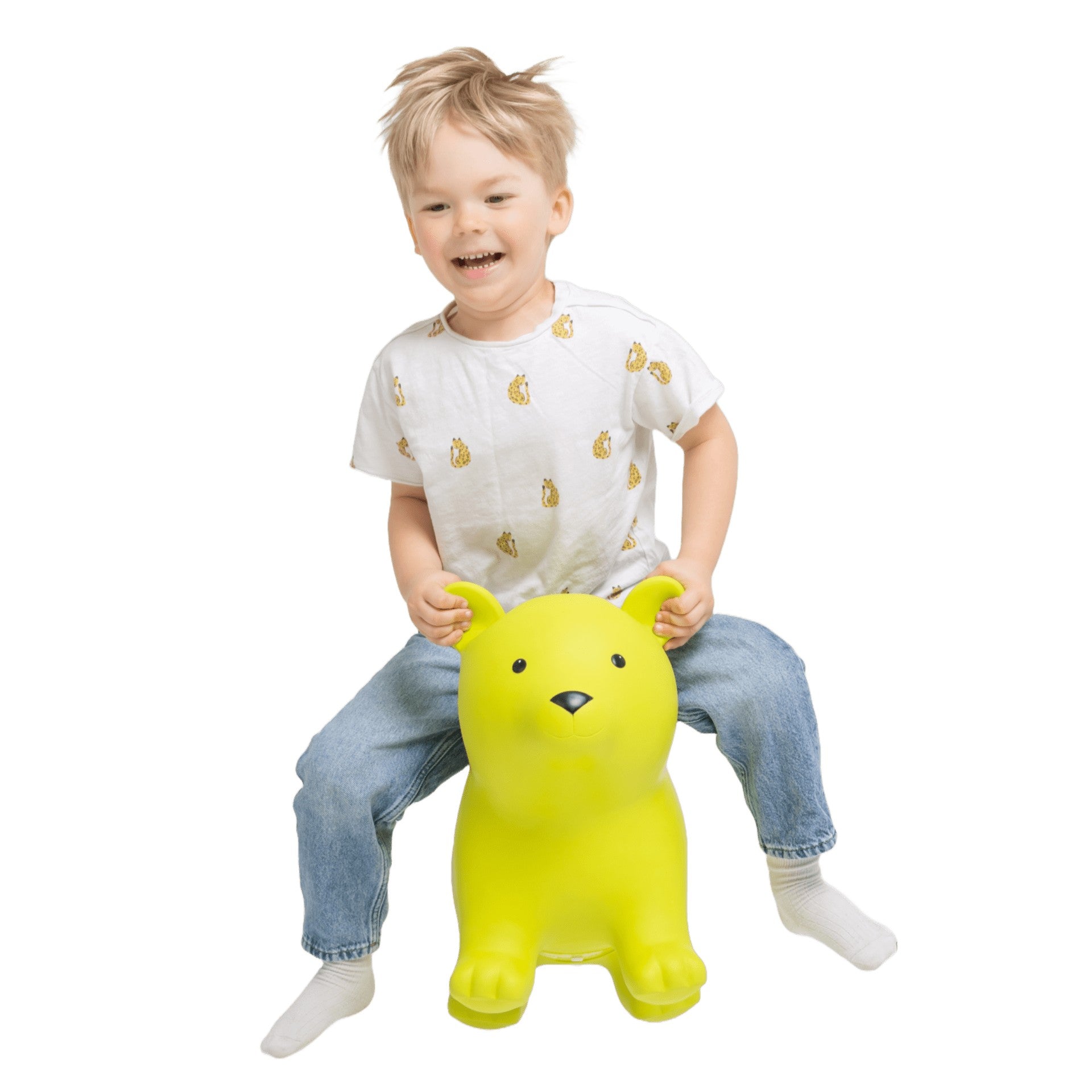 confident toddler bouncing high on a vibrant green bear hopper toy