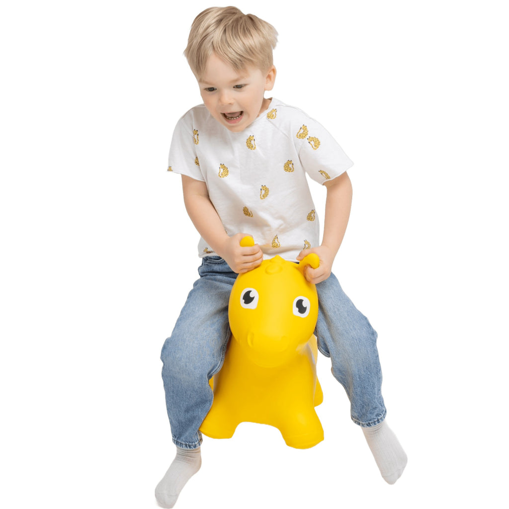 bold yellow horse hopper toy for toddlers on a bright background
