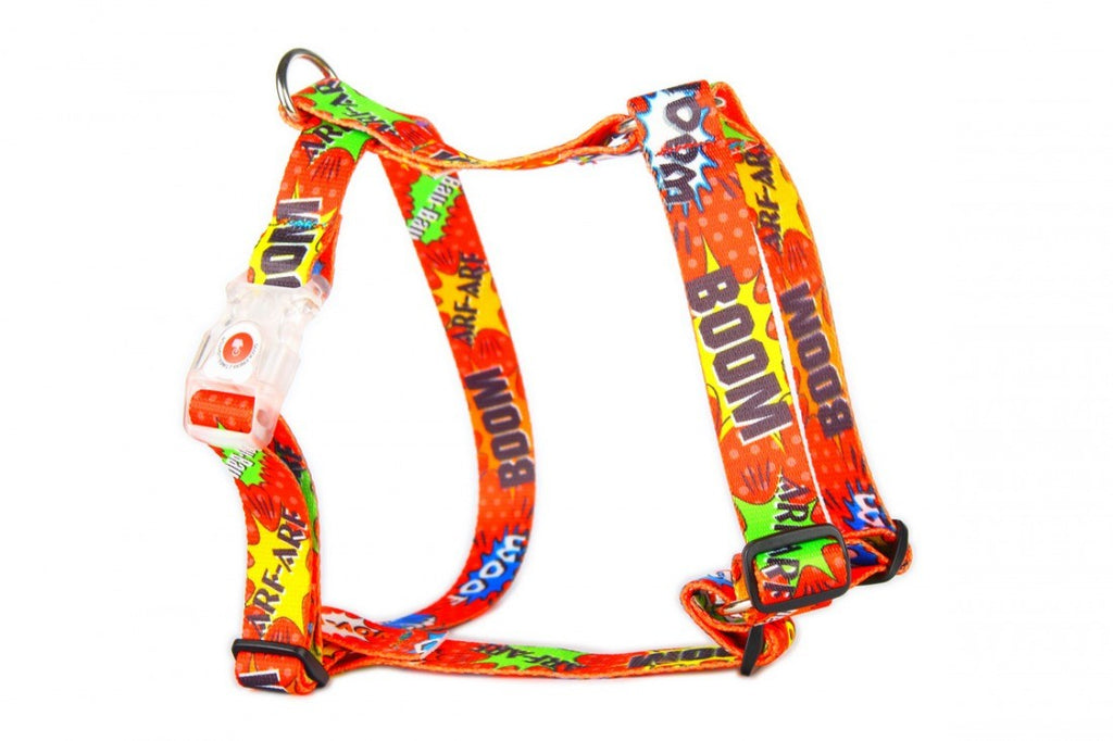 soft red graffiti dog harness with adjustable straps in cozy indoor light