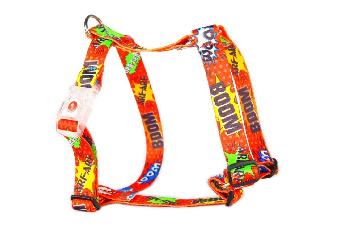 soft red graffiti dog harness with adjustable straps in cozy indoor light