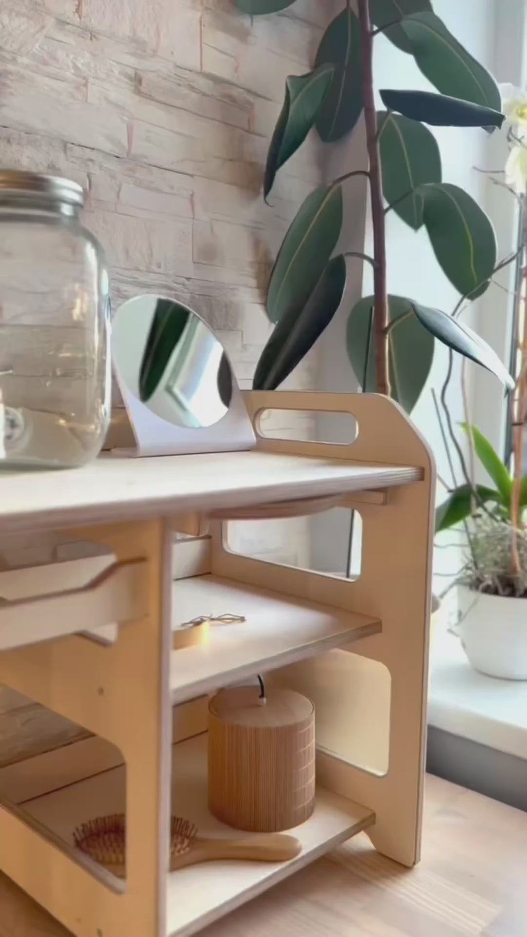 a soft-lit view of the montessori wooden washbasin showing its smooth, untreated plywood and the enamel bowl, ready for a toddler's gentle handwashing routine