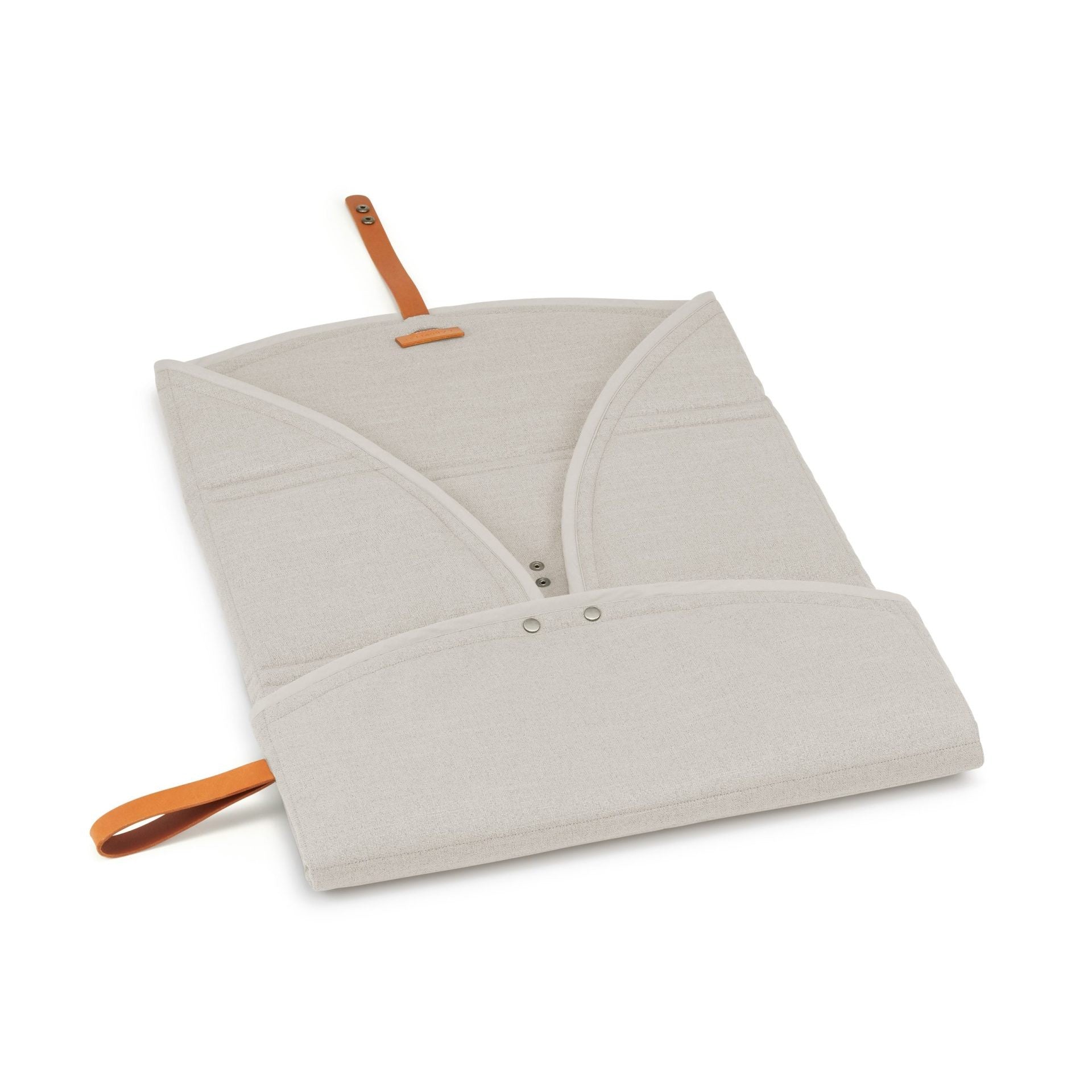 elegant beige okka travel mat with a luxurious leather belt detail, laid out on a polished floor