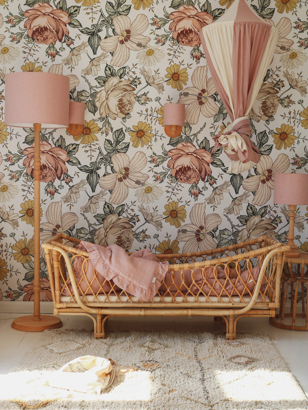 powder pink organic cotton linen canopy hanging over a child's bed with soft morning light