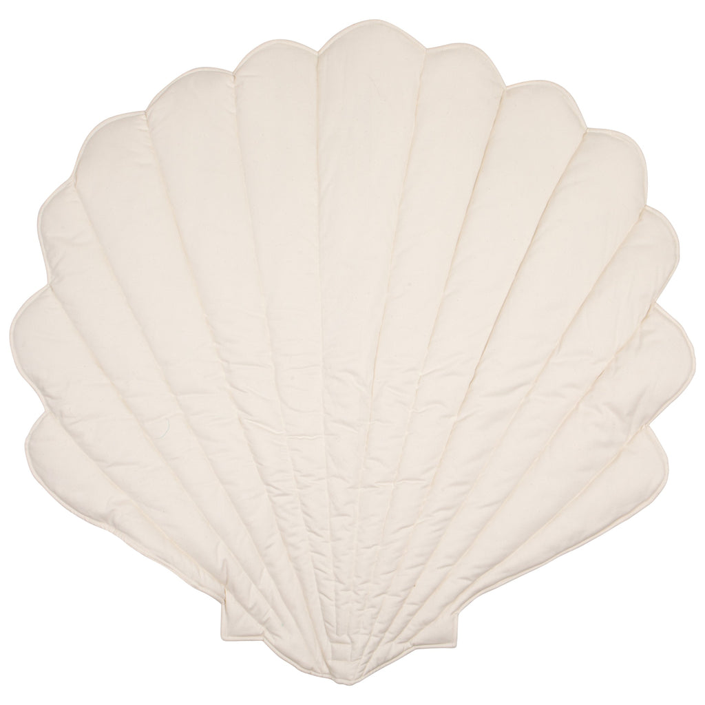 elegant handmade ginkgo leaf playmat in sand on a minimalist wooden floor
