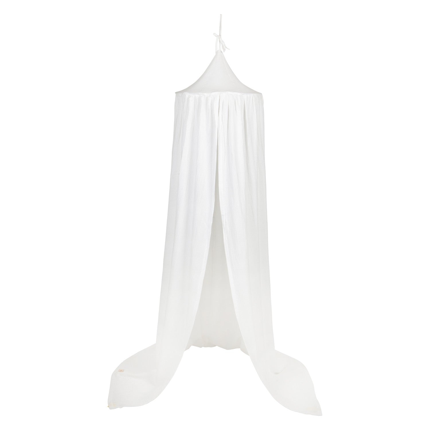 organic cotton cream canopy draped gracefully over a bed, soft light filtering through the fabric