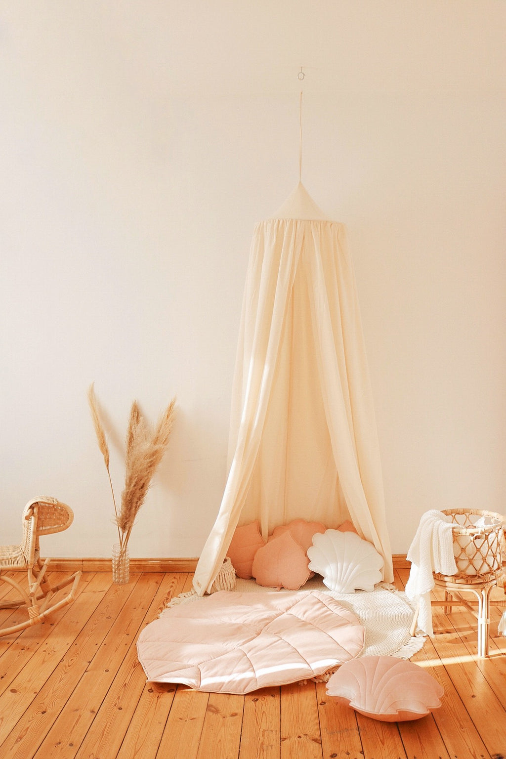 elegant raw cotton canopy draped gracefully over a bed, soft natural folds catching golden afternoon light