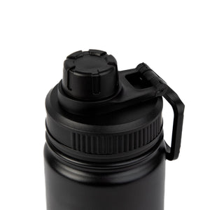 a soft-focus shot of the matte black pippi thermal bottle resting on a cozy wool blanket