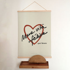 bold vita felice poster in dramatic lighting on a modern dark wall