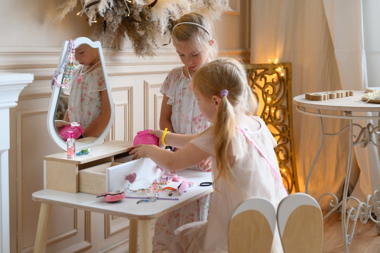 a soft-lit tulip princess vanity with a cozy chair, ready for quiet dress-up play