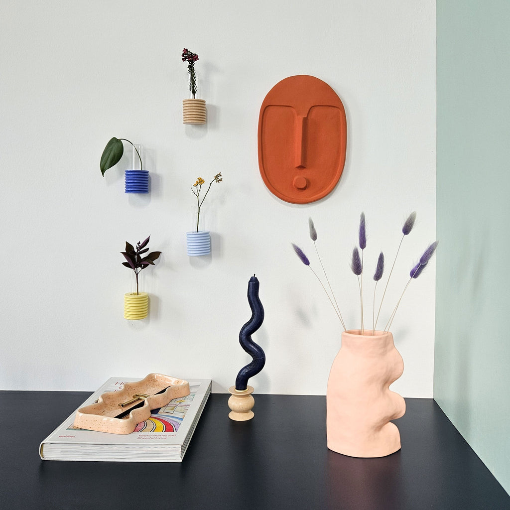 elegant blue ribble wall vase in soft light on a neutral background