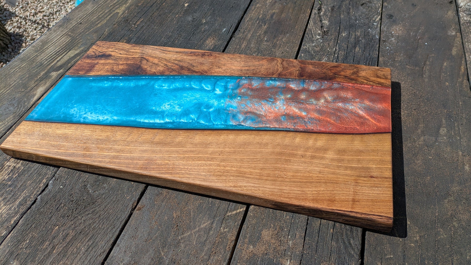 Walnut striking blue and bronze river board