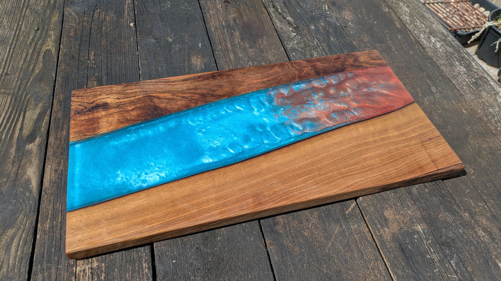 Walnut striking blue and bronze river board