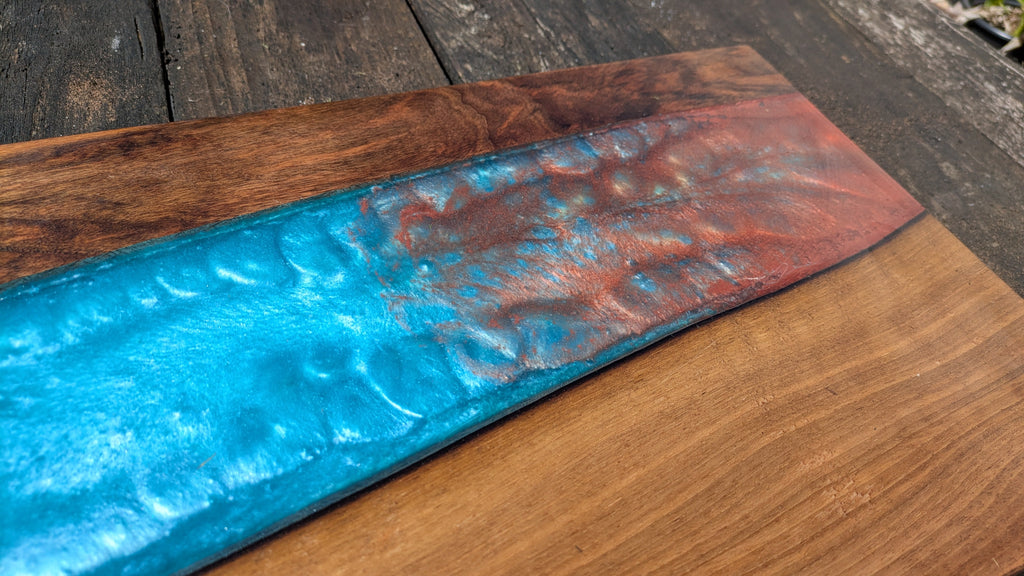 Walnut striking blue and bronze river board