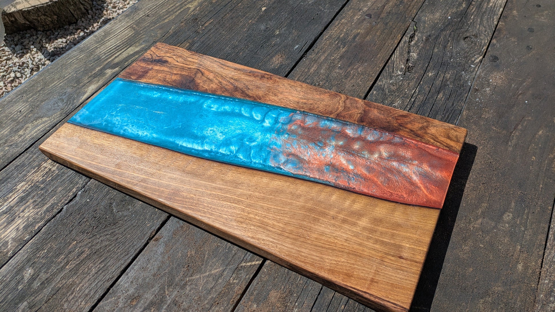 Walnut striking blue and bronze river board