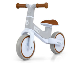 a soft-focus shot of the velo balance bike's comfortable seat and non-slip grips, ready for a toddler's first ride