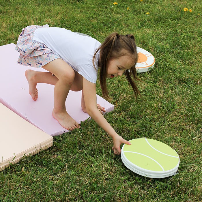 pastel foam play mats stacked neatly for easy storage, showcasing durability and soft texture