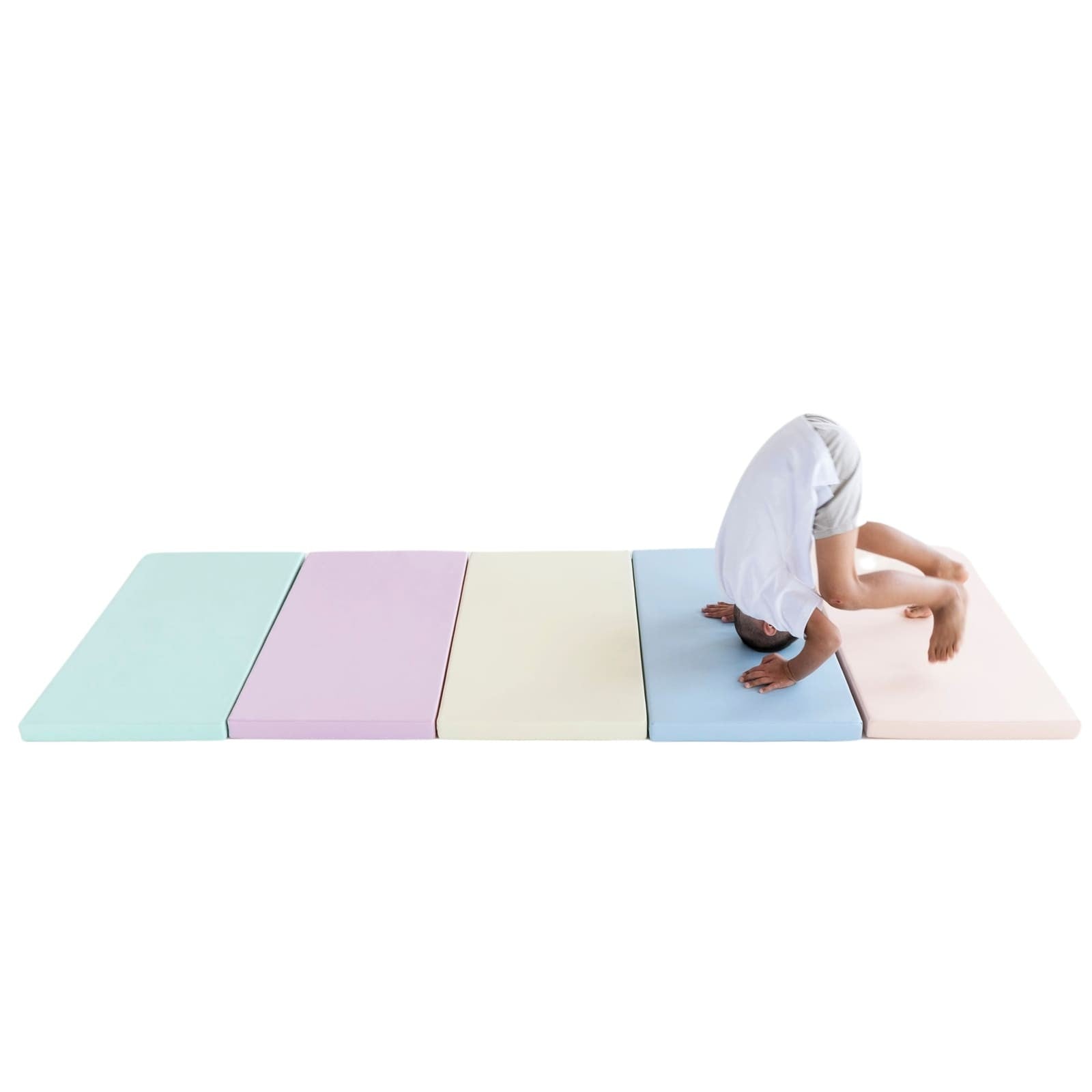 pastel foam play mats stacked in soft sunlight, perfect for toddler safety and creative play