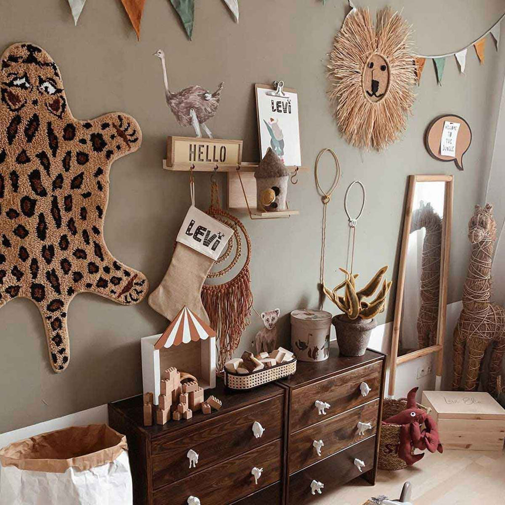 practical guide showing the scale of savanna wonderland wall stickers on a measuring grid
