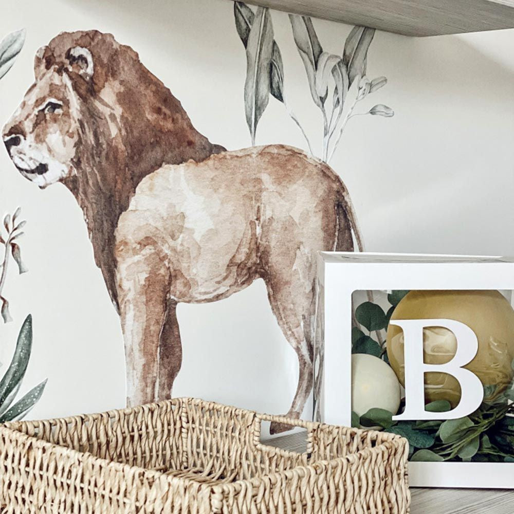 a close-up detail of the savanna wonderland wallstickers showing the soft matte texture and pastel botanical-style flamingo and lemur