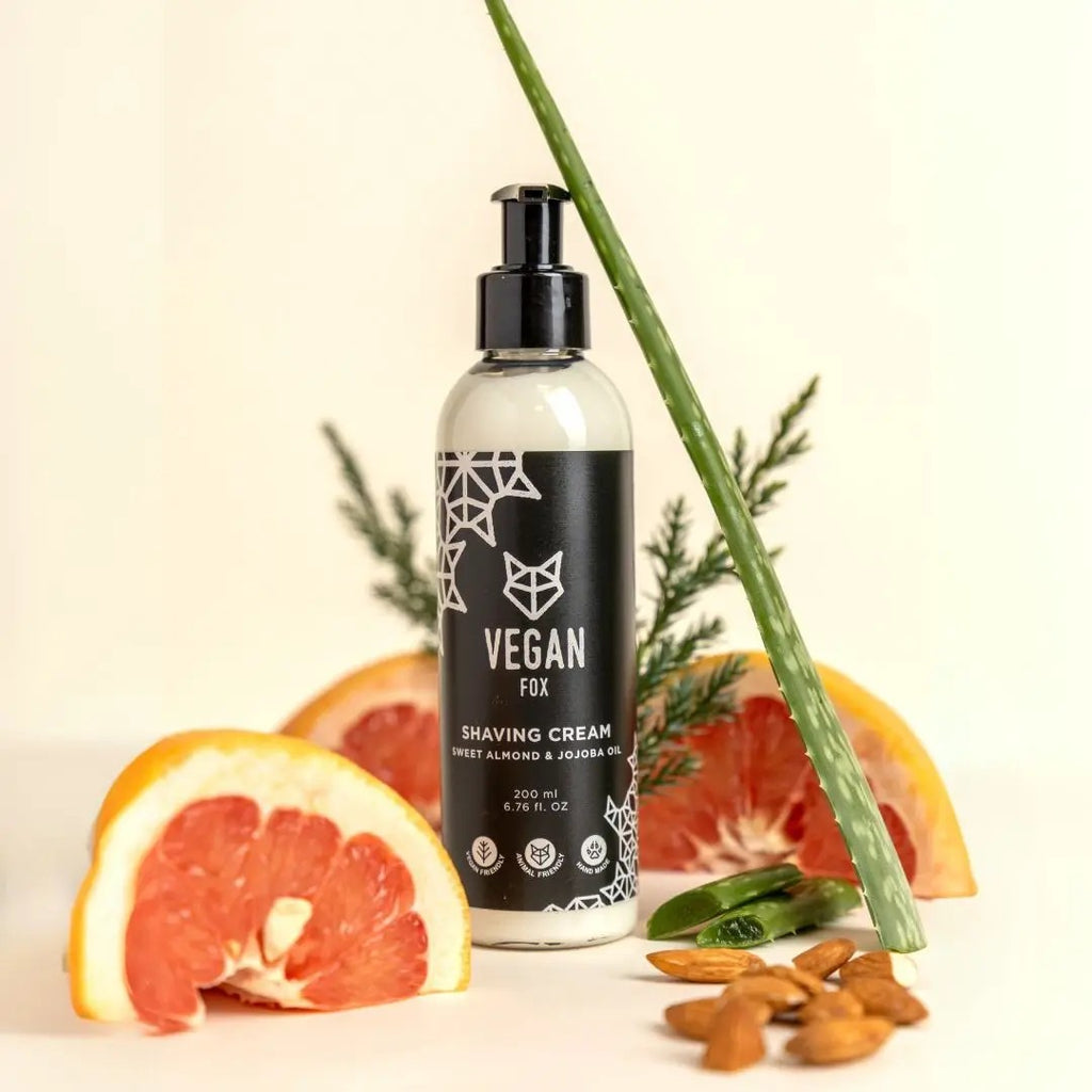 playful close-up of vegan shaving cream with fresh forest scent, grapefruit and cedar notes, in recyclable bottle