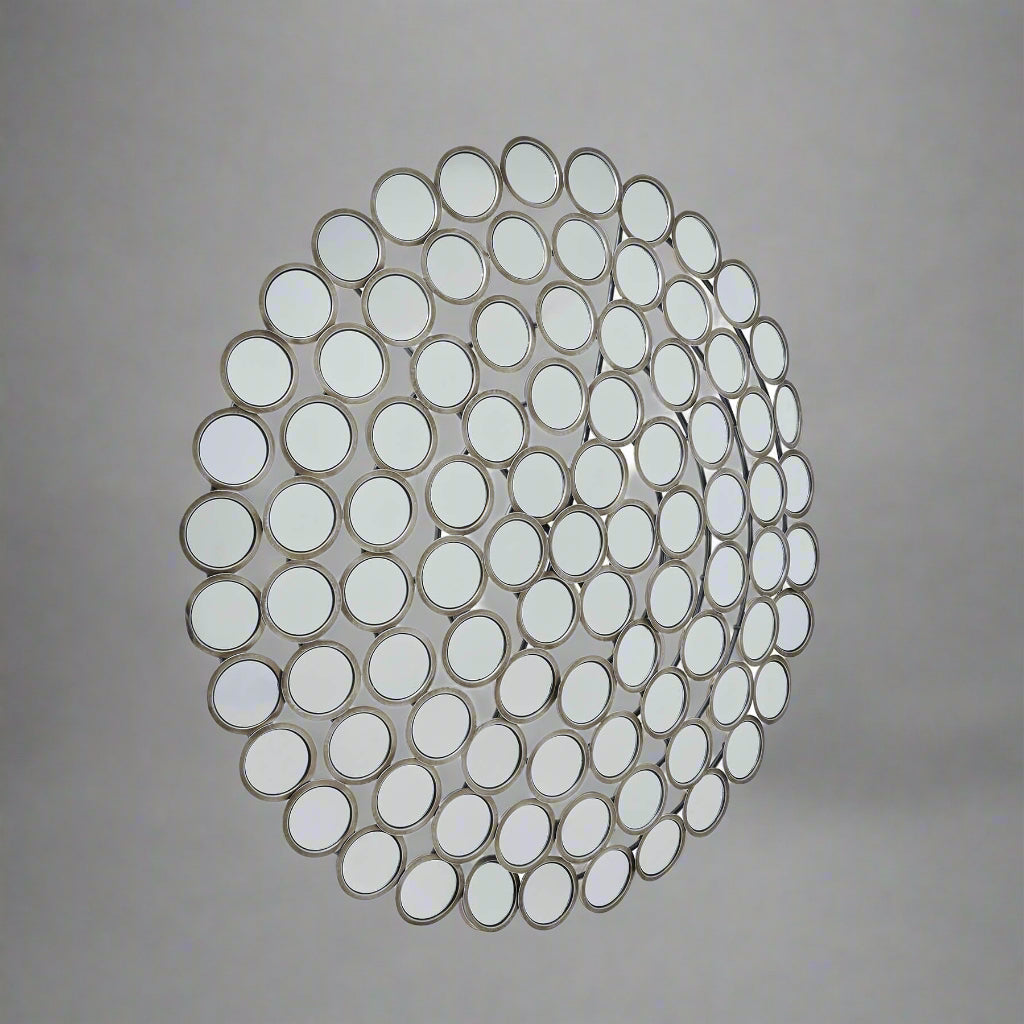 Antiqued silver convex mirror with intricate circular segments, vintage style, 100 cm diameter, enhances light and space. by Sostter at brixbailey.com