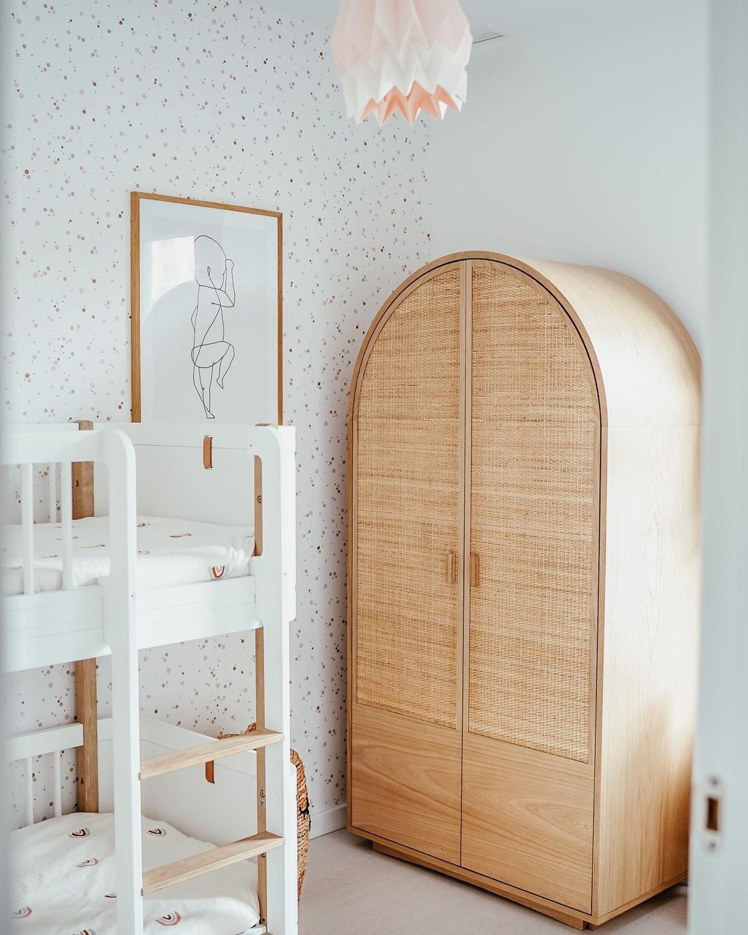 playful cinnamon and pink dots wallpaper close-up with a fun, whimsical texture for a kids room