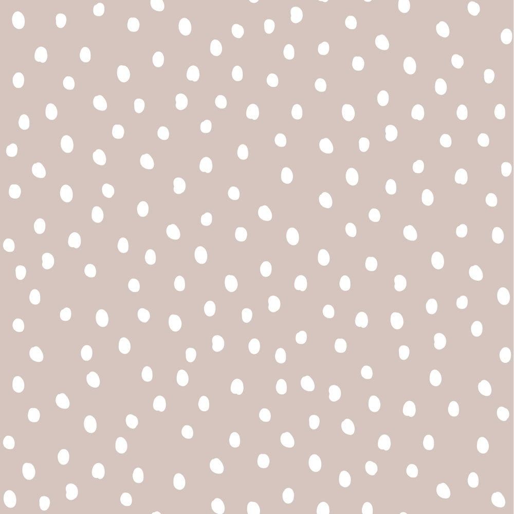 close-up detail of chic powder pink and white irregular dots wallpaper showing its matte texture and easy-to-match pattern