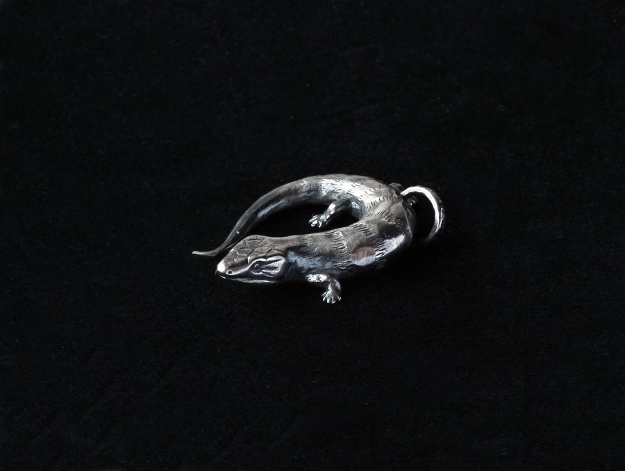 Handcrafted Silver Blue Tongue Skink Charm – Unique Estonian Design by Hvitolg at www.brixbailey.com