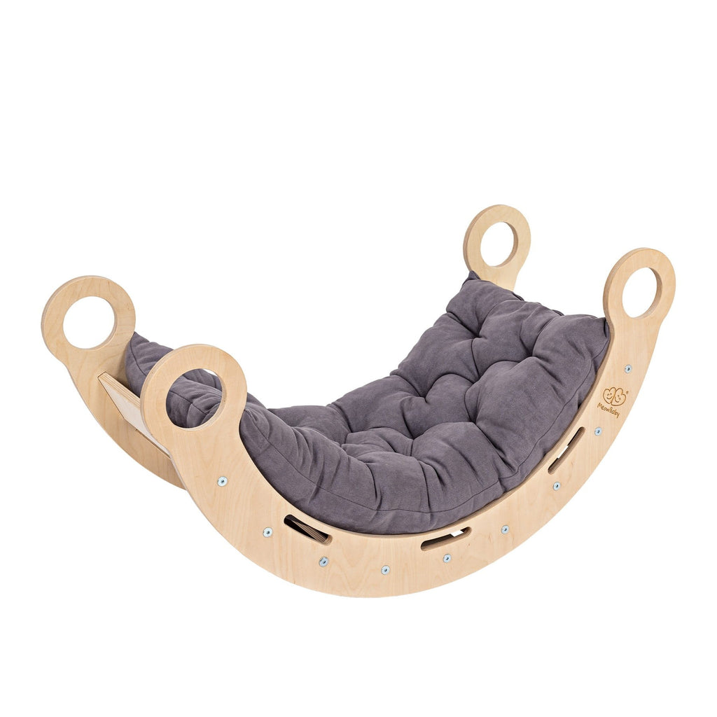a child peeking through the snug rocker tunnel with soft morning light