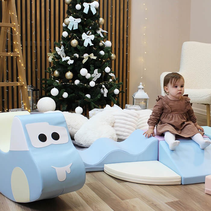 light blue soft play car toy for toddlers, promoting balance and motor skills with a fun, active design