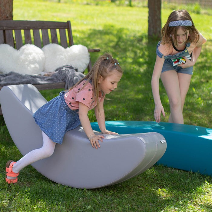 soft grey banana rocking toy for toddlers, cozy and safe for developing balance and motor skills