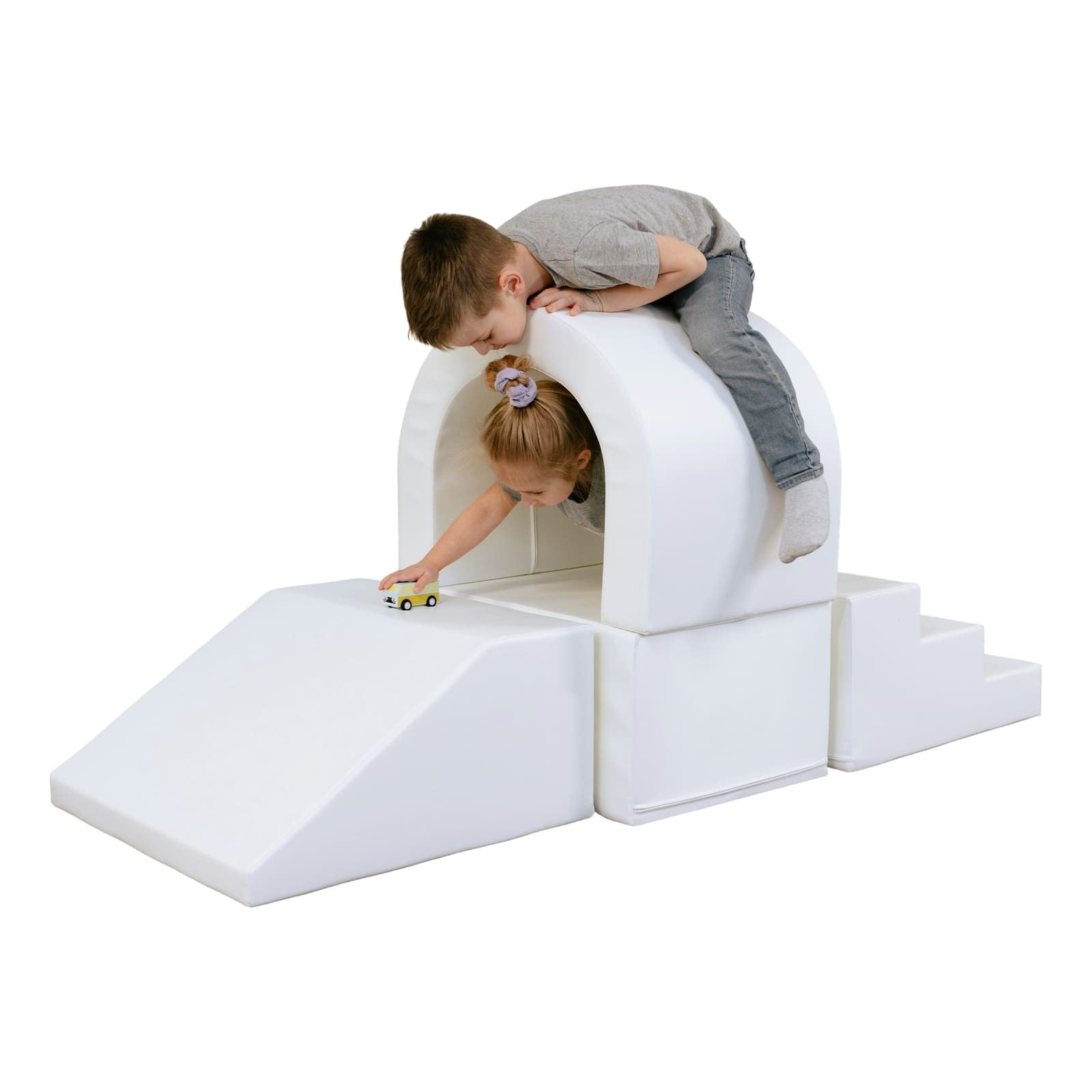 white soft play tunnel for kids crawling through with giggles, fostering creativity and motor skills